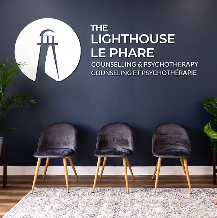 The Lighthouse Le Phare The Lighthouse–Le Phare reception seating beneath the bilingual clinic sign